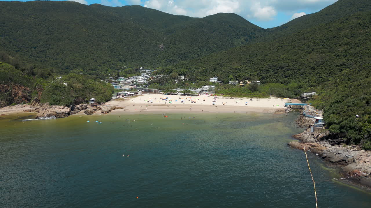 Waves Roll Into Big Wave Bay Shek O Hong Kong Island China Drone Track In Descend 4K 60FPS