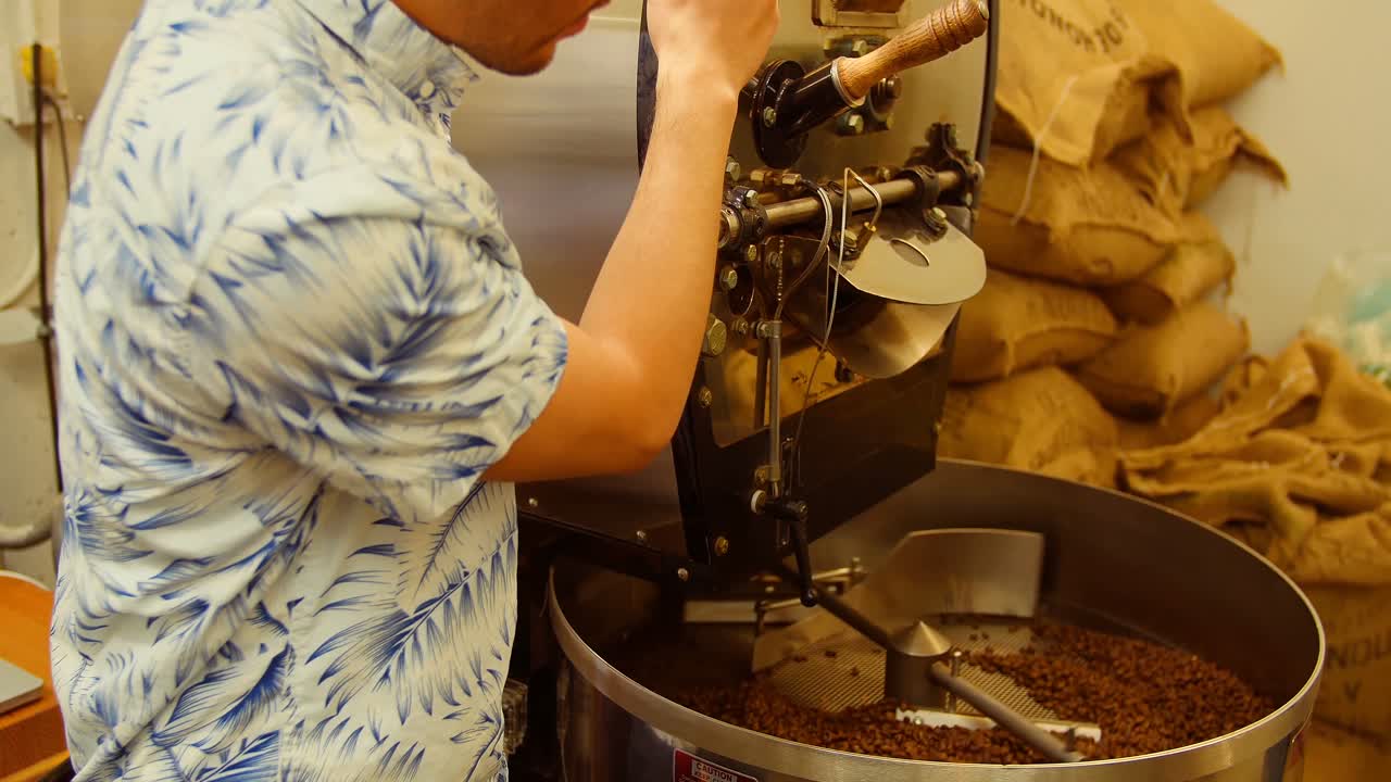 Man using coffee grinding machine