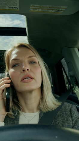 woman talking on phone while driving