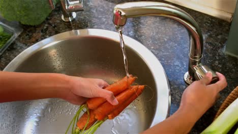 woman washing carrots