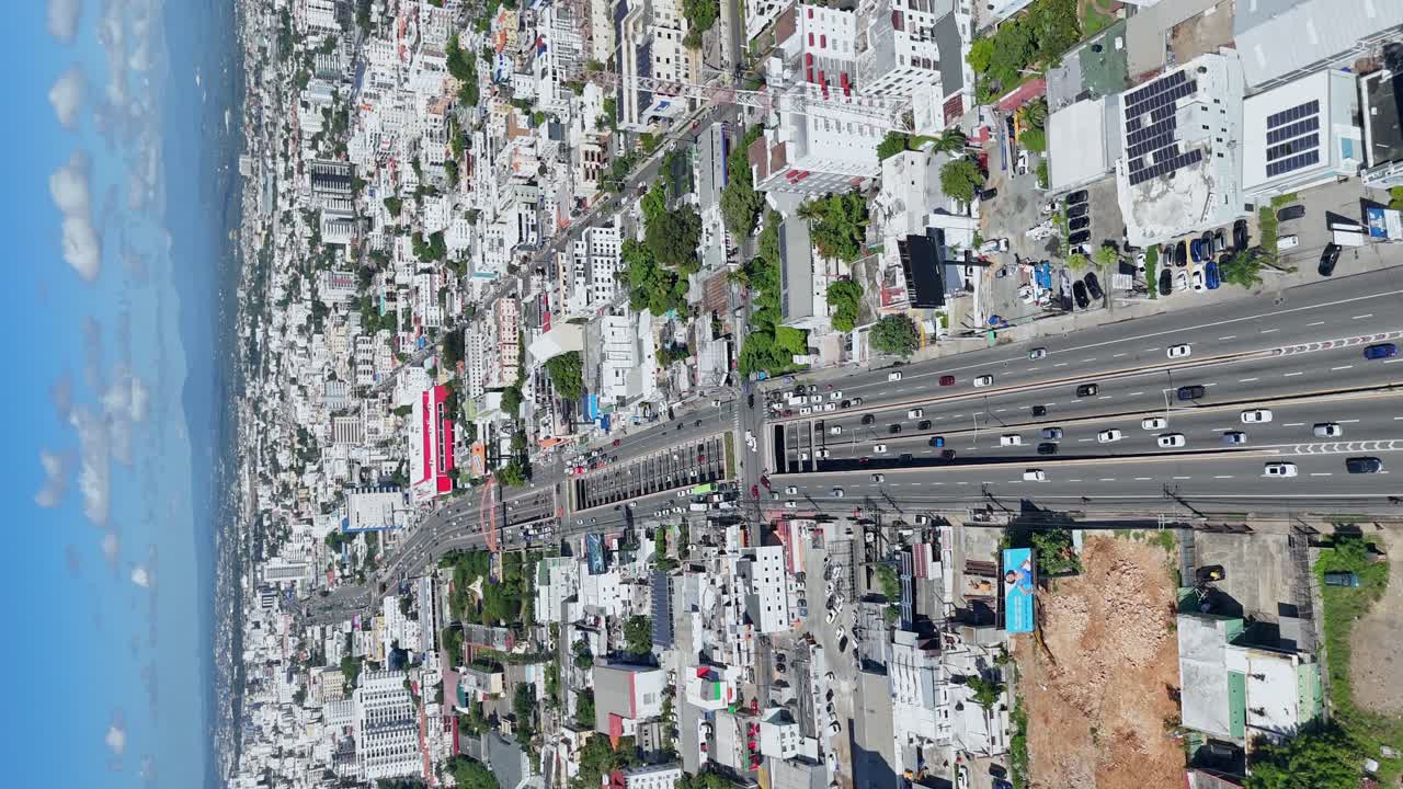 Vertical drone view of 27 de Febrero Avenue, one of the main roads in the city of Santo Domingo in the Dominican Republic.