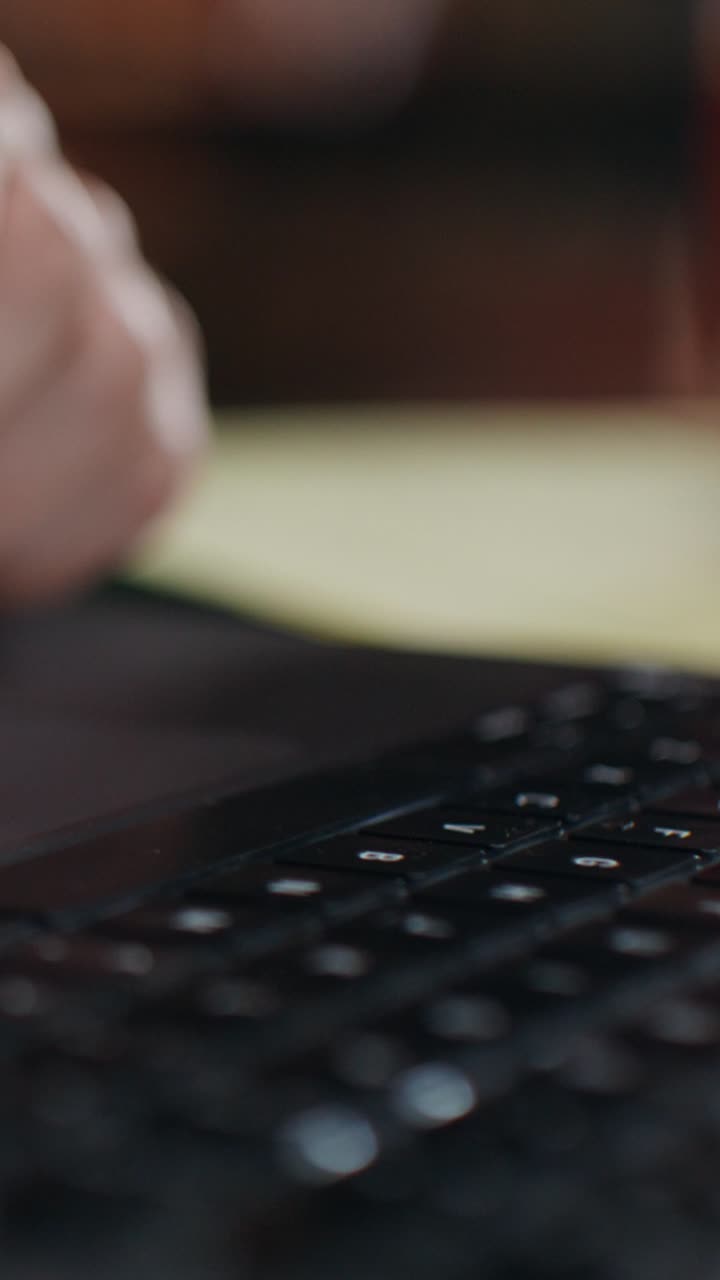 Person Typing on a Laptop Keyboard