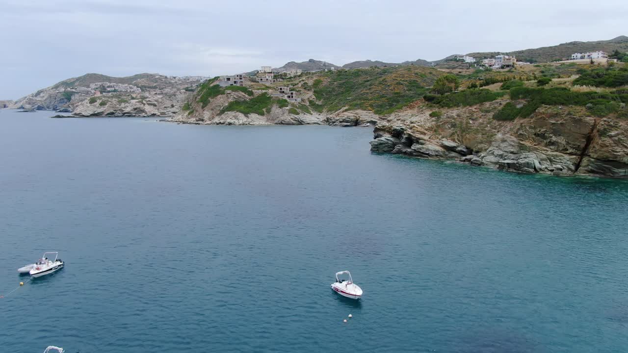 Aerial shot of boats navigating on the coast of Agia Pelagia, a village in Crete