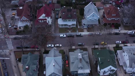 Drone-flyover-large-detached-houses-in-the-Ditmas-Park-neighborhood-of-Brooklyn,-NY,-right-before-sunset