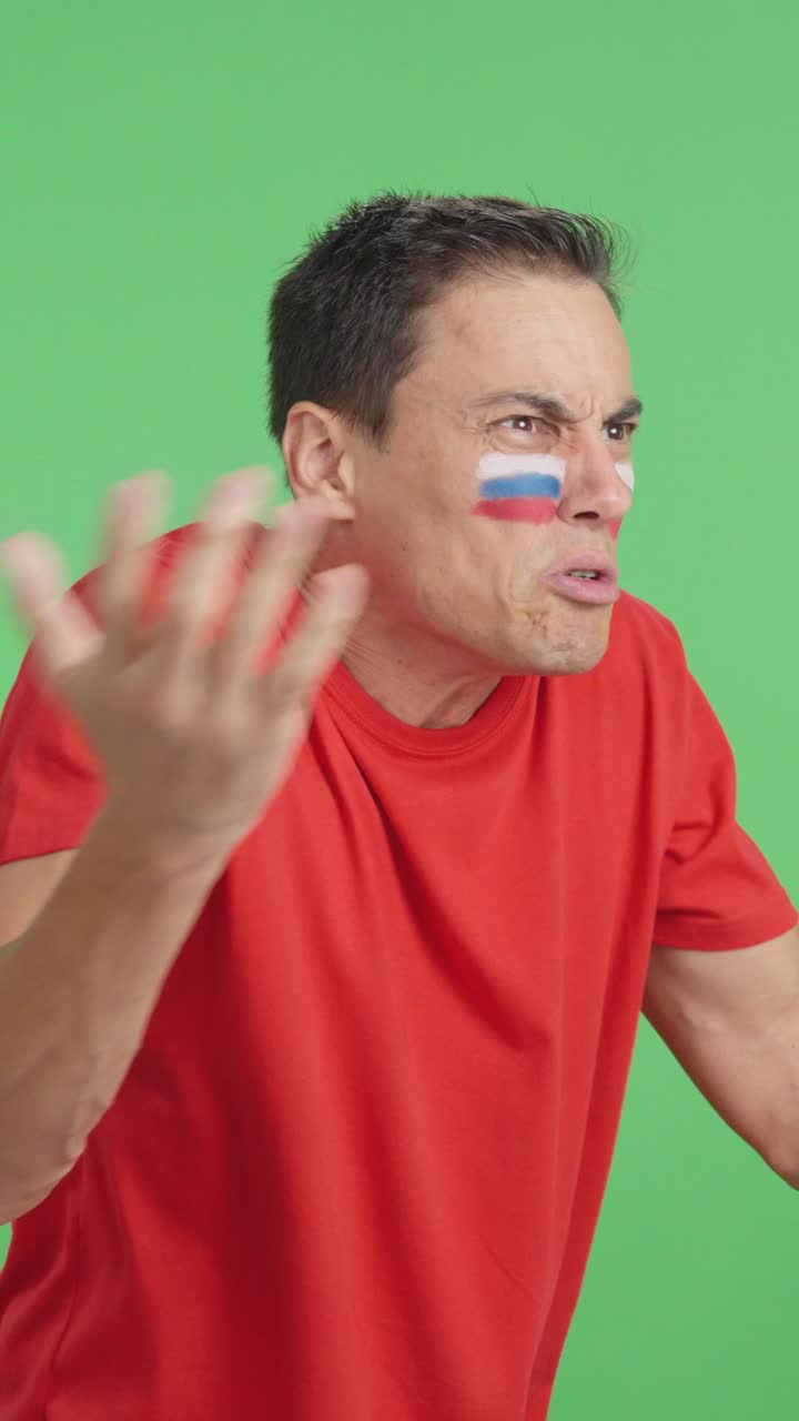 Man cheering for Russia, angry with the decision of referee