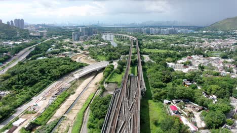 Hong-Kong-MTR-Railroad-in-the-city-outskirts,-Aerial-view