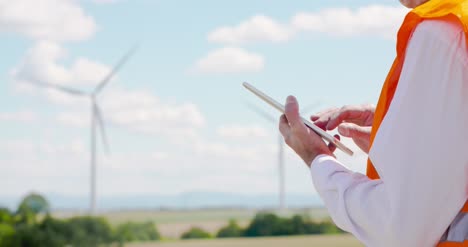 engineer using digital tablet at windmills farm 2