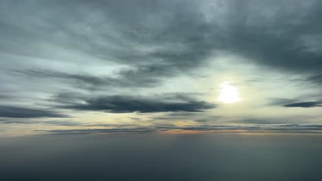 dramatic sky recorded from a jet cockpit while flying at 12000 metres high in a cold winter afternoon