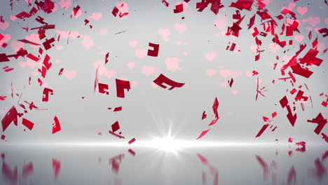 red heart turning and exploding on grey background