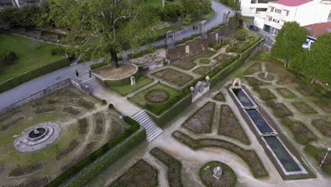 Aerial-crane-shot,-Palacio-de-Cristal-gardens-in-Porto-city,-Portugal