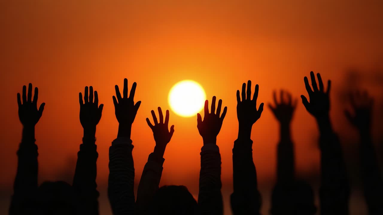 A Stunning Silhouette of Raised Hands Against a Vibrant Sunset Sky, Symbolizing Unity, Hope, and Collective Aspiration in a Melodious Evening Setting