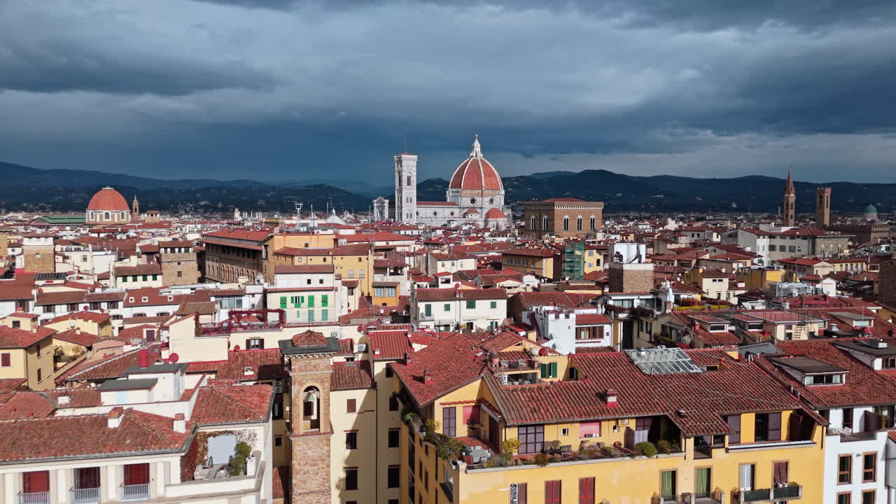 Florence cityscape with the Cathedral of Santa Maria del Fiore under a dramatic sky