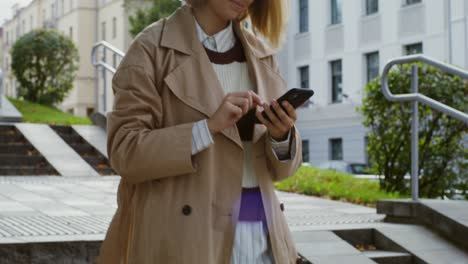 woman using phone outdoors