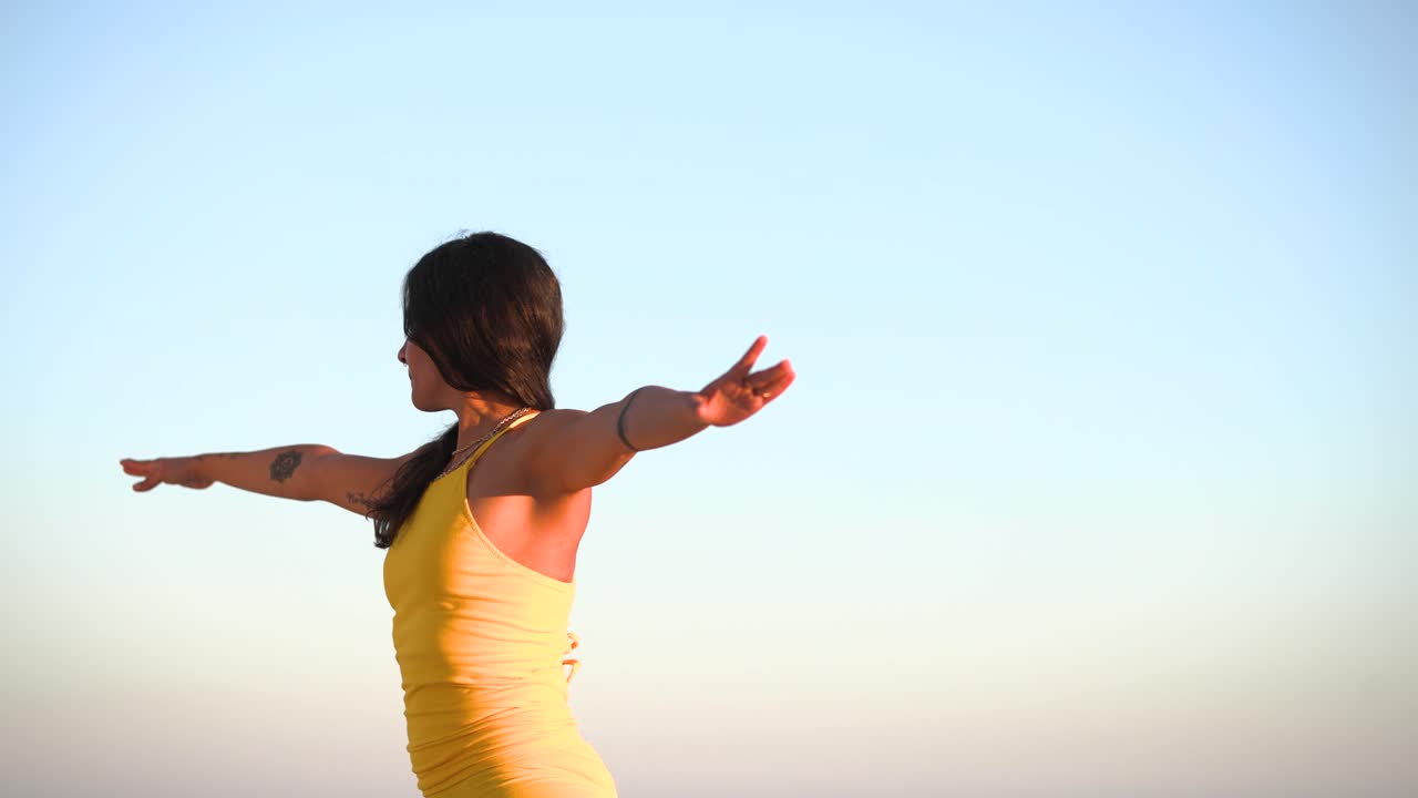 Yoga instructor recording online class at beach