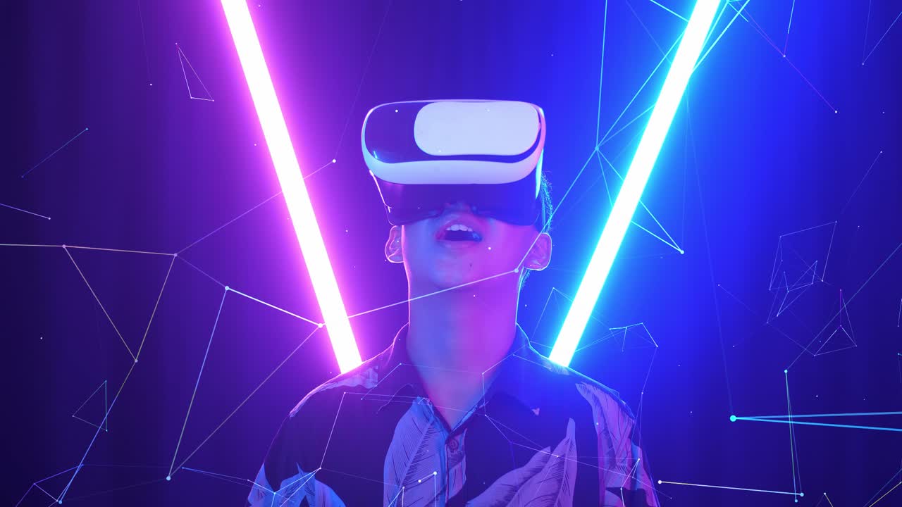 Vr, Futuristic, Entertainment Concept. Excited Asian Boy Using Virtual Reality Headset With Neon Light At The Background