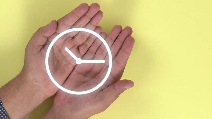 Clock animation symbol that appears on 2 hands that open in the form of a book