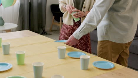 couple setting the table