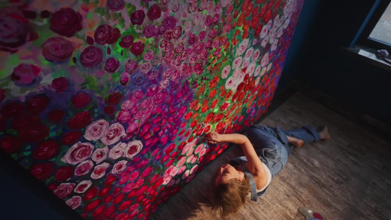 Woman Artist Painting Large Floral Canvas on the Floor