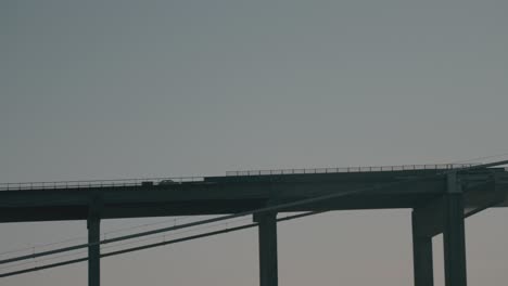 car driving over bridge in middelfart, denmark