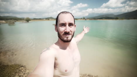 skinny mid aged hispanic enjoying the moment at huesca lake spain