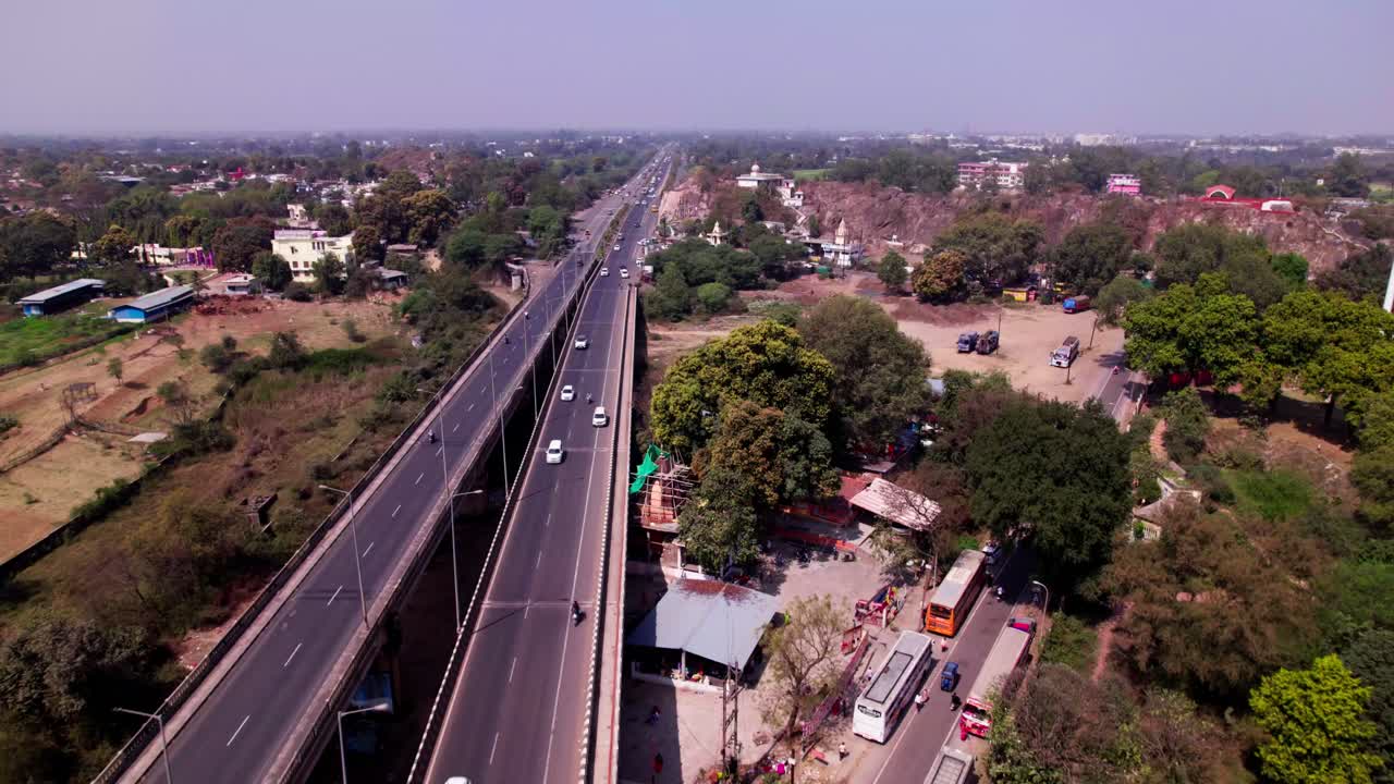 Tilwara Bridge with national highway 12 and light poles on road at tilwara, jabalpur, madhya pradesh, india. day time, push in, drone shot, 4k.