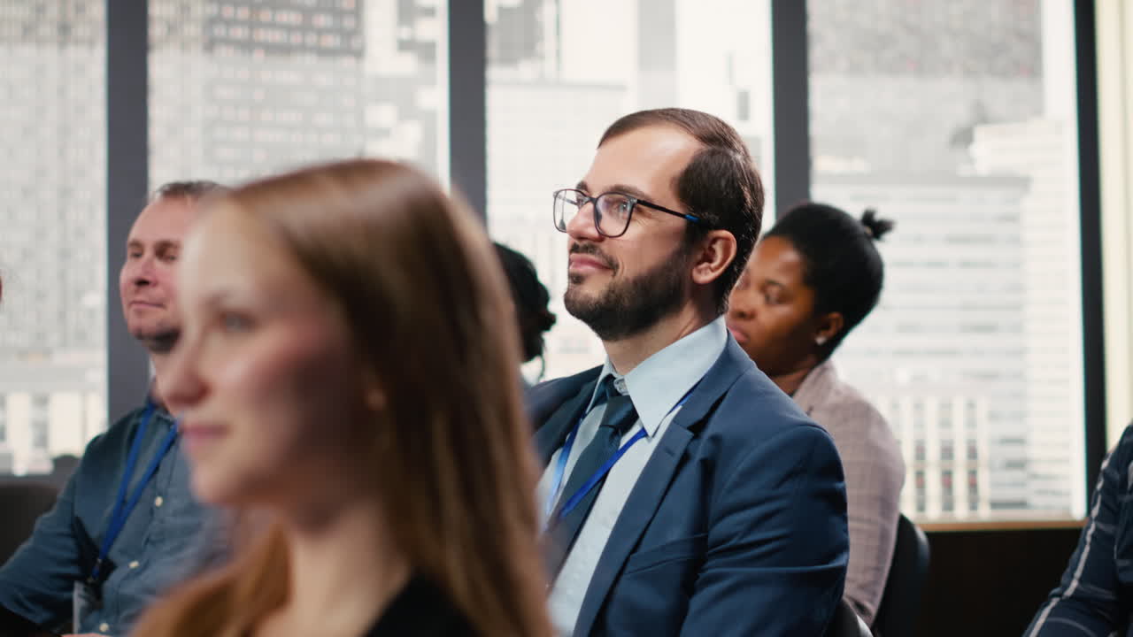 Male CEO attending conference and paying attention to discussion