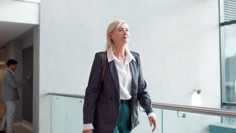 businesswoman walking in modern office