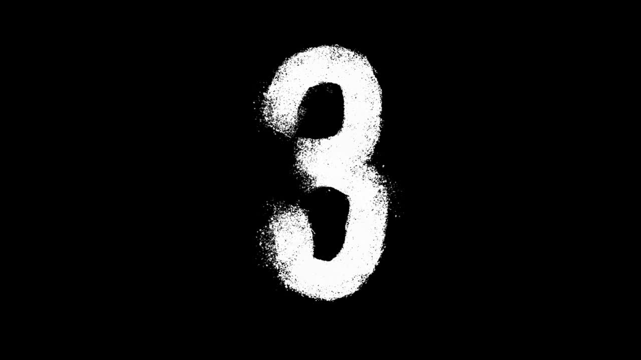 Numero 3 bianco con vernice spray su sfondo nero.