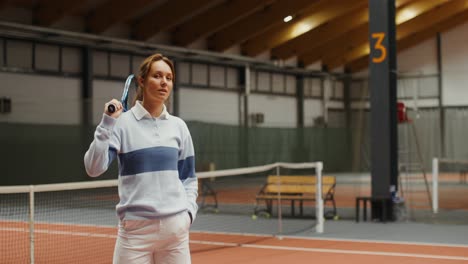 woman playing tennis indoor