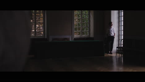 Man Standing in a Historical Interior
