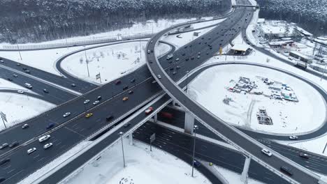 aerial view of a freeway intersection snow-covered in winter.