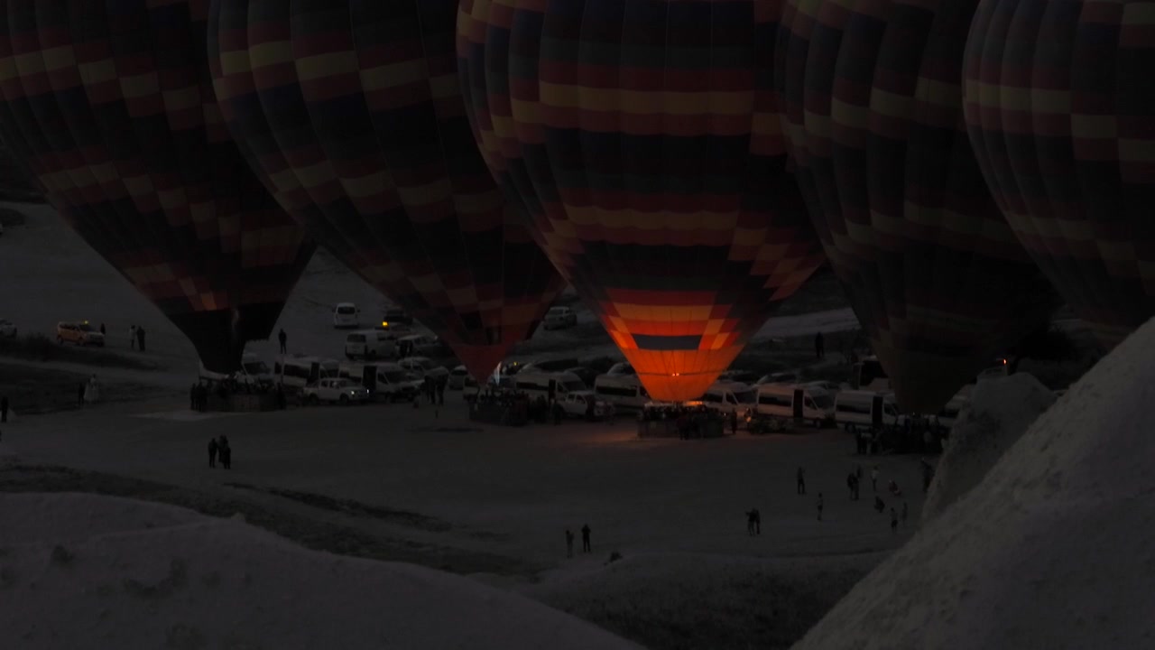 Hot Air Balloons Preparing for Flight at Dawn in Cappadocia