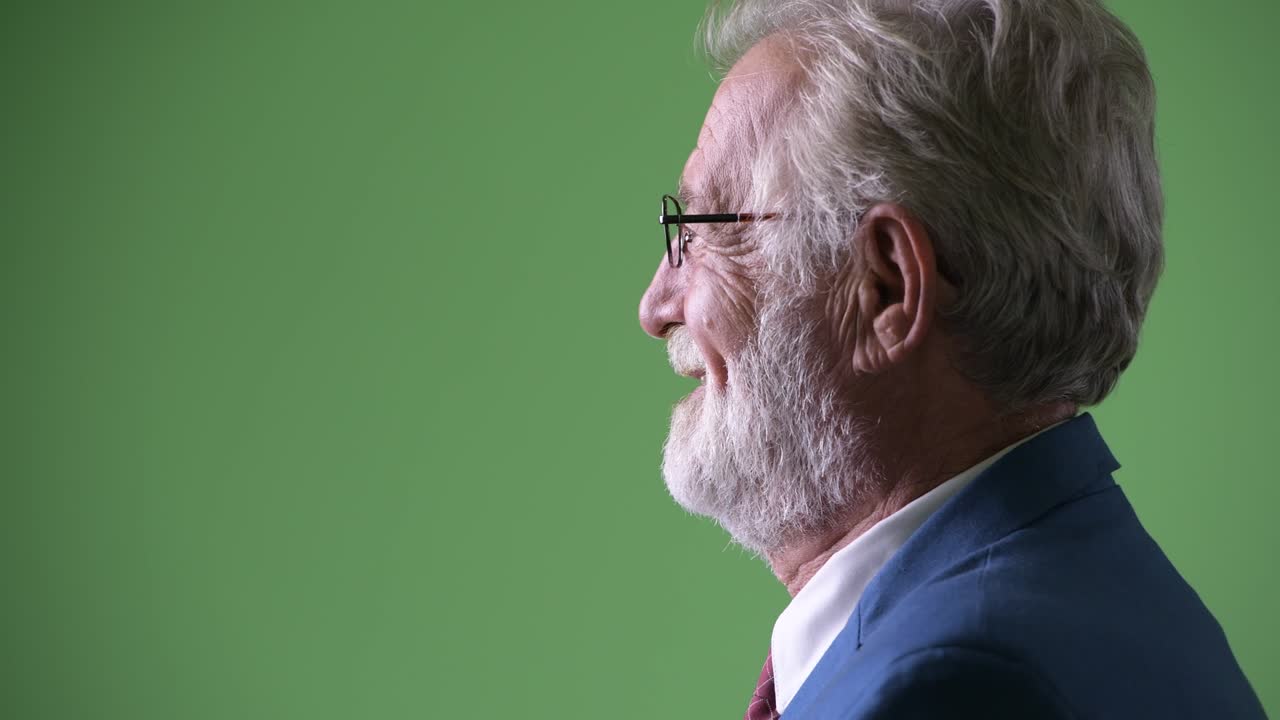 초록색 배경 에 있는 잘생긴 수염 이 있는 상인