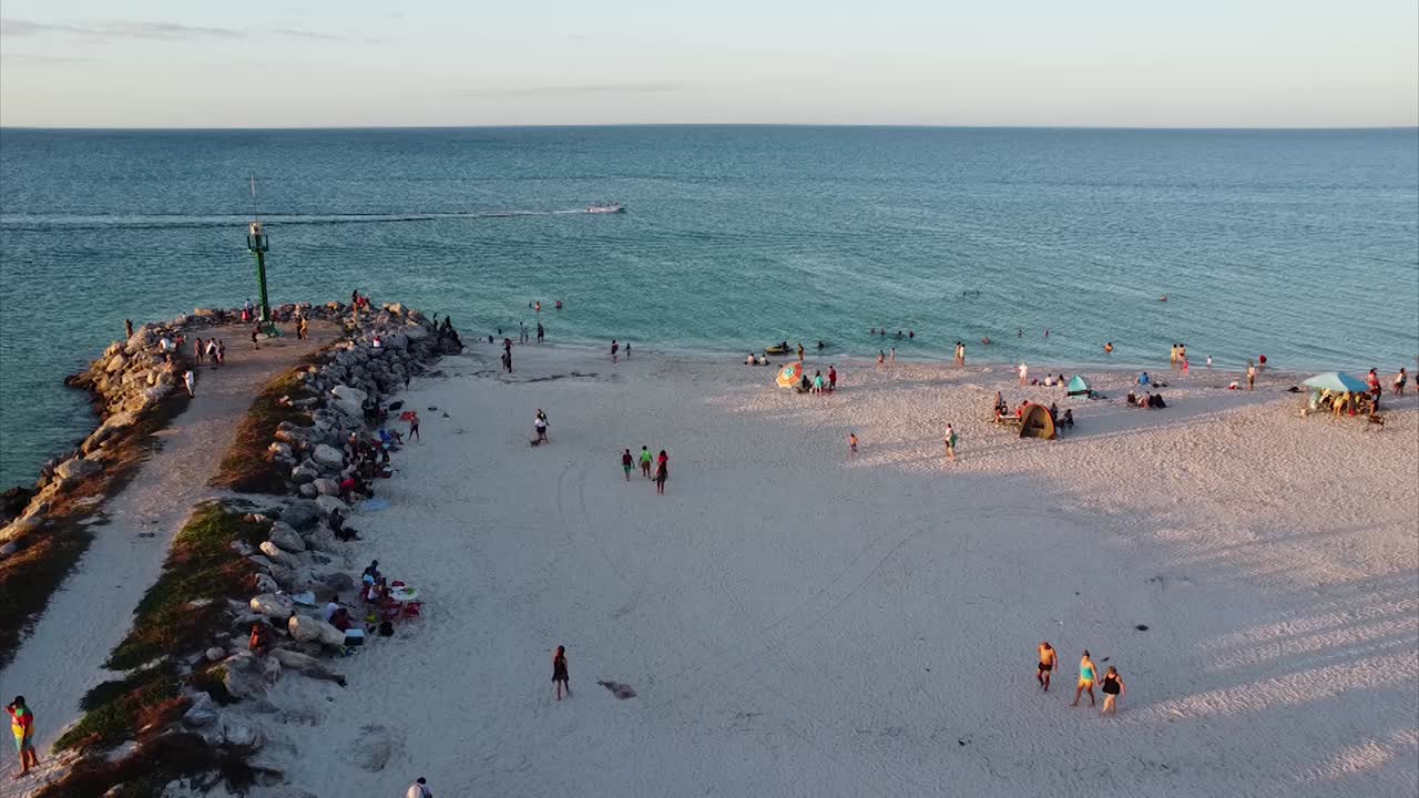 Aerial View of Crowded Beach at Sunset