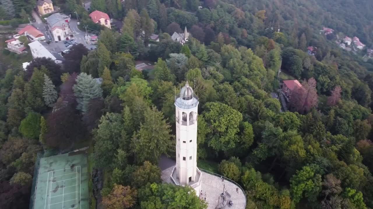 Volta Lighthouse overlooking Como Lake and the city on a clear evening, Brunate, Italy, Europe