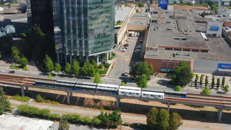 aerial view of skytrain rapid transit traveling on the expo line in city of burnaby, canada