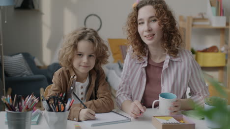 mother and child studying together at home