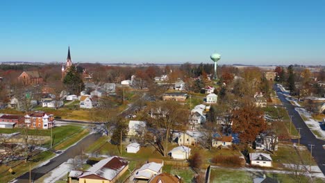 a drone aerial over a small town in america in winter snow riverside iowa 1