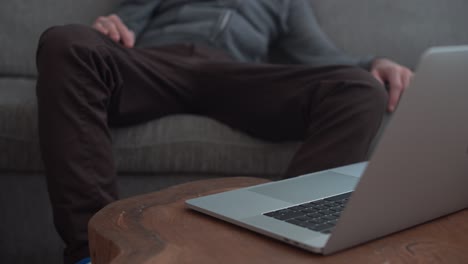 Lazy man sits on soda and can't reach the computer - gives up
