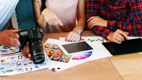 group of graphic designers working together at desk