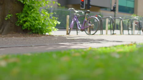 Close-Up-Of-Woman-Wearing-Training-Shoes-Exercising-Running-Along-Path-In-City-Park-1