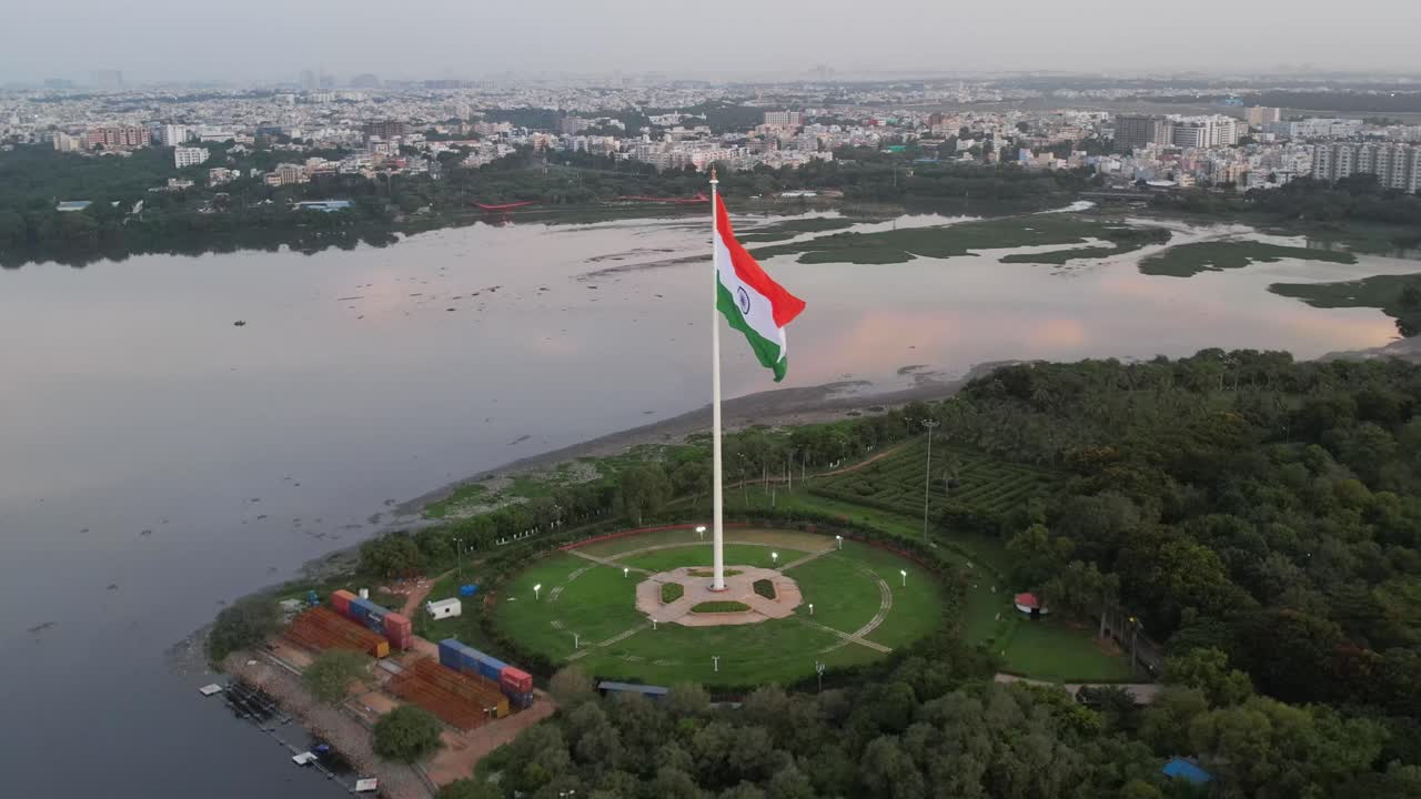 Aerial cinematic footage of the tallest Indian flag in the world near the lake India's flag is flying high
