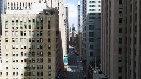 Aerial-view-flying-through-buildings-in-downtown-Toronto