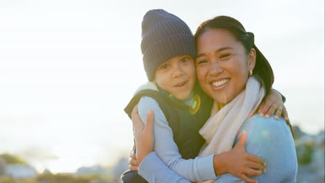 Sunshine,-mother-and-son-hug-in-portrait