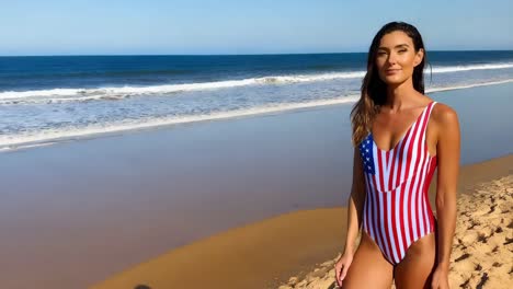 woman in american flag swimsuit on beach