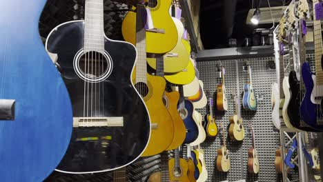 classical guitars on display in an instrument store. discounts on musical instruments.