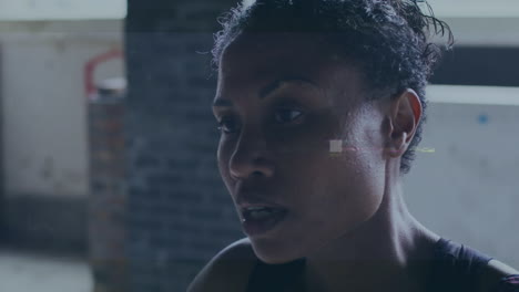animation of data processing over training african american female athlete at rest