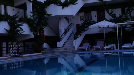 outdoor pool with hotel accommodations at the luxury getaway at rhodes, greece