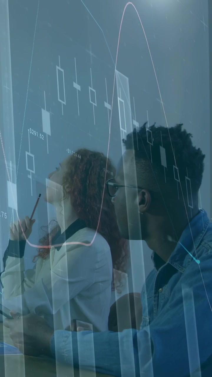 Vertical video: Finance charts appearing, woman tapping pen and man typing laptop, reviewing data
