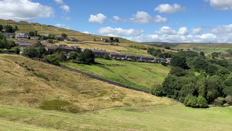 old rural country houses cottages on a hillside in marsden west yorkshire united kingdom, surrounded by hills and fields